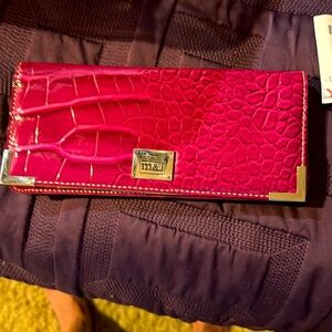 M&j wallet 8 1/2 inches wide 4 inches high a quarter inch with